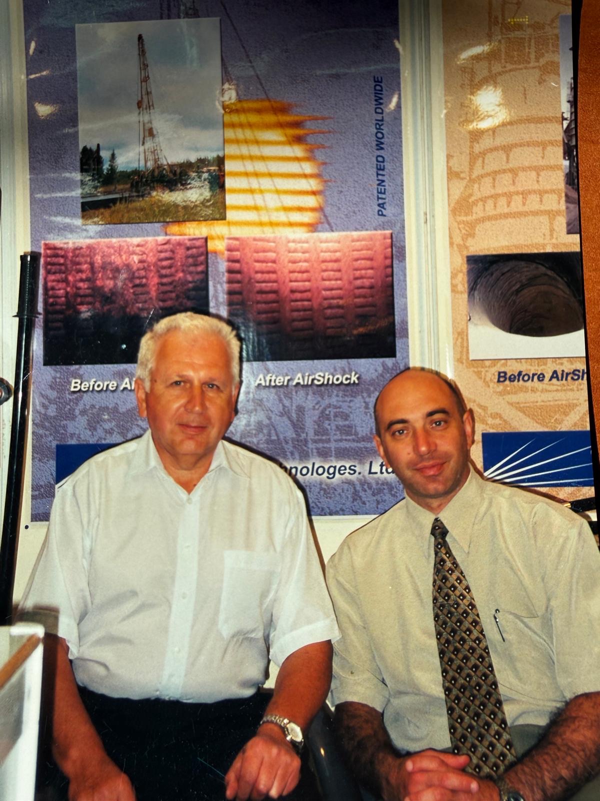 Dr. Gennady Carmi and chief engineer Yuri As at ProWell Technologies' first exhibition booth, with early before/after AirShock panels